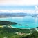 Langkawi's coastline including the bay, scattered forested islands, a marina and distant mountain ranges